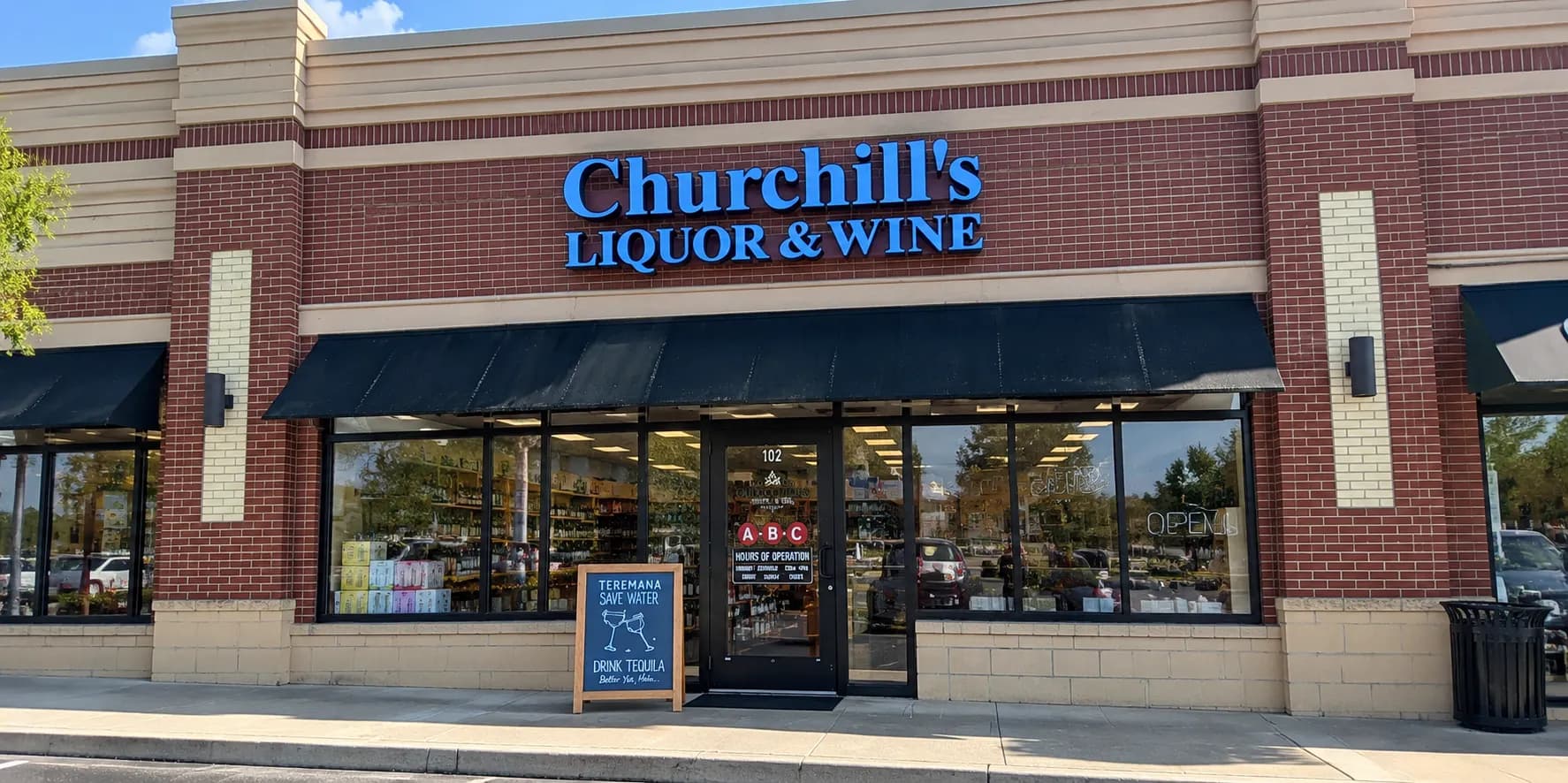The Churchill's Liquor & Wine storefront on SC-160 in Fort Mill, with its blue illuminated sign